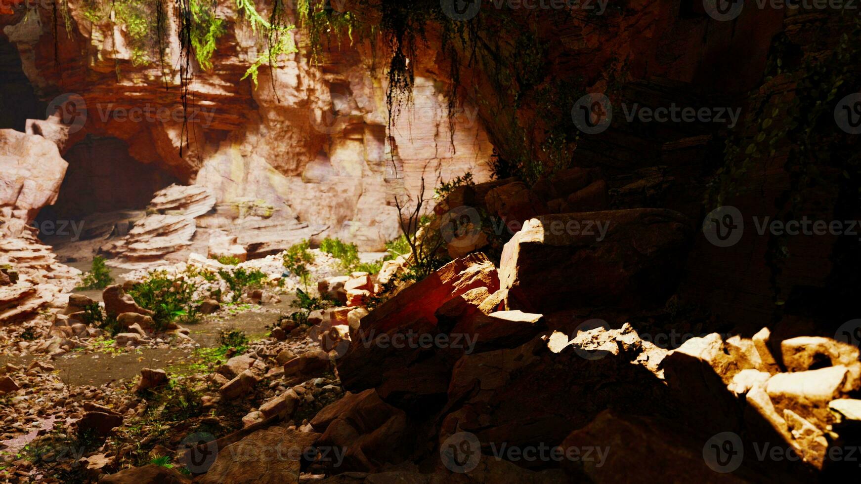 A cave filled with natural rock formations and lush vegetation photo