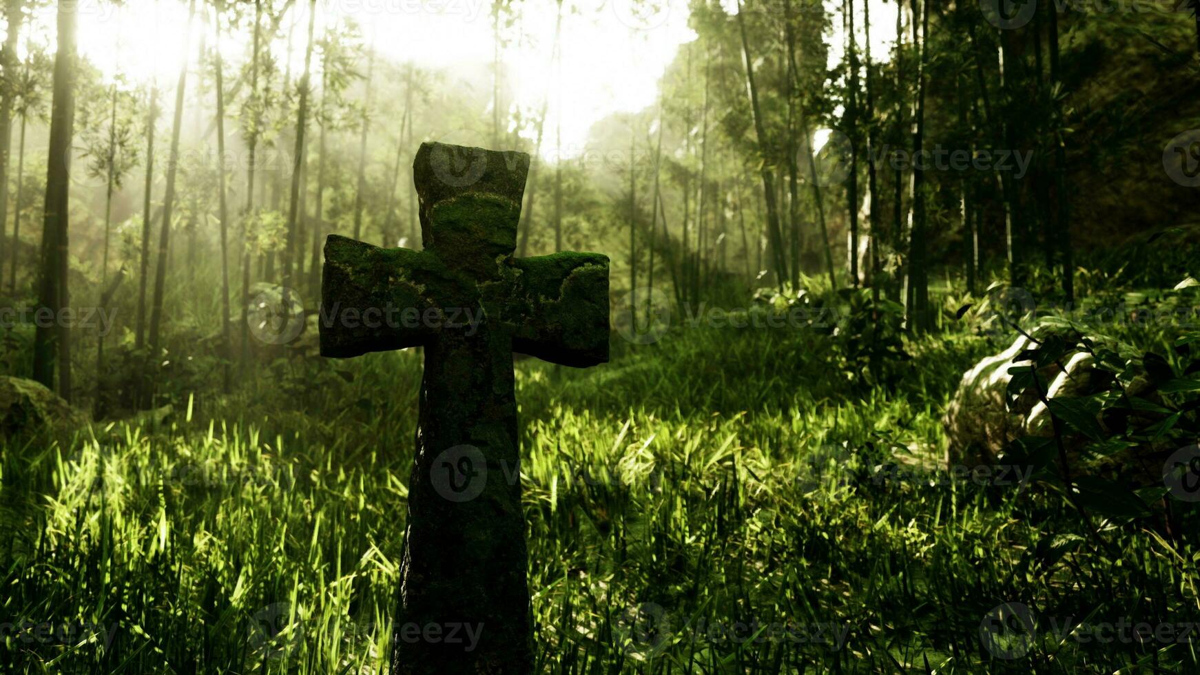 old stone grave cross in a tropical forest photo