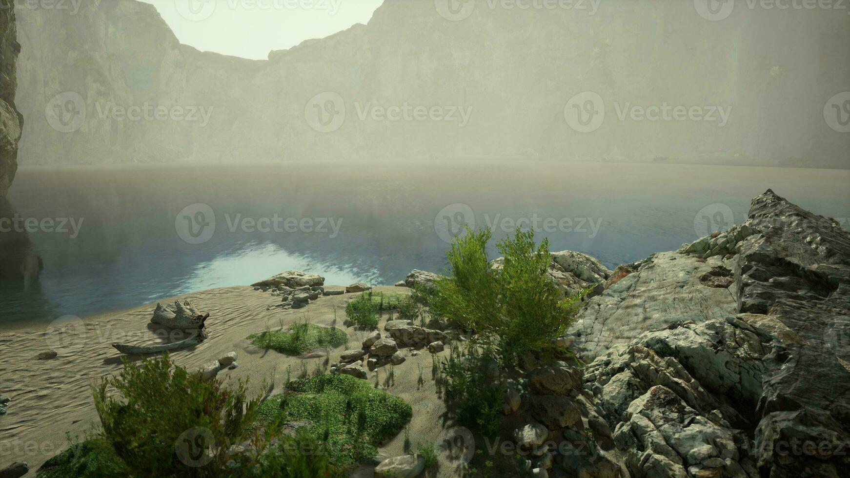 A serene mountain lake reflecting the surrounding peaks photo