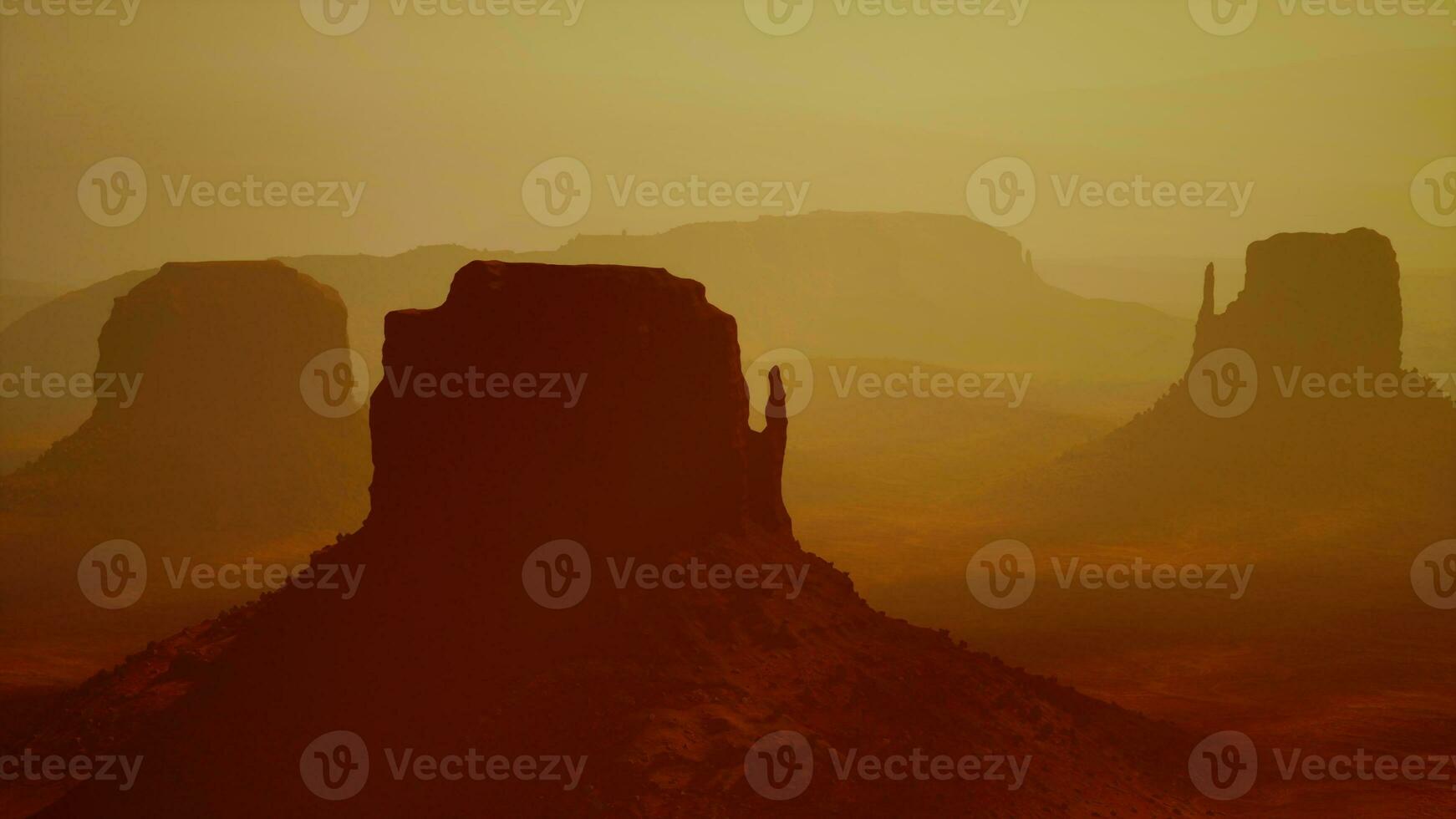 Sunset at the sisters in Monument Valley photo