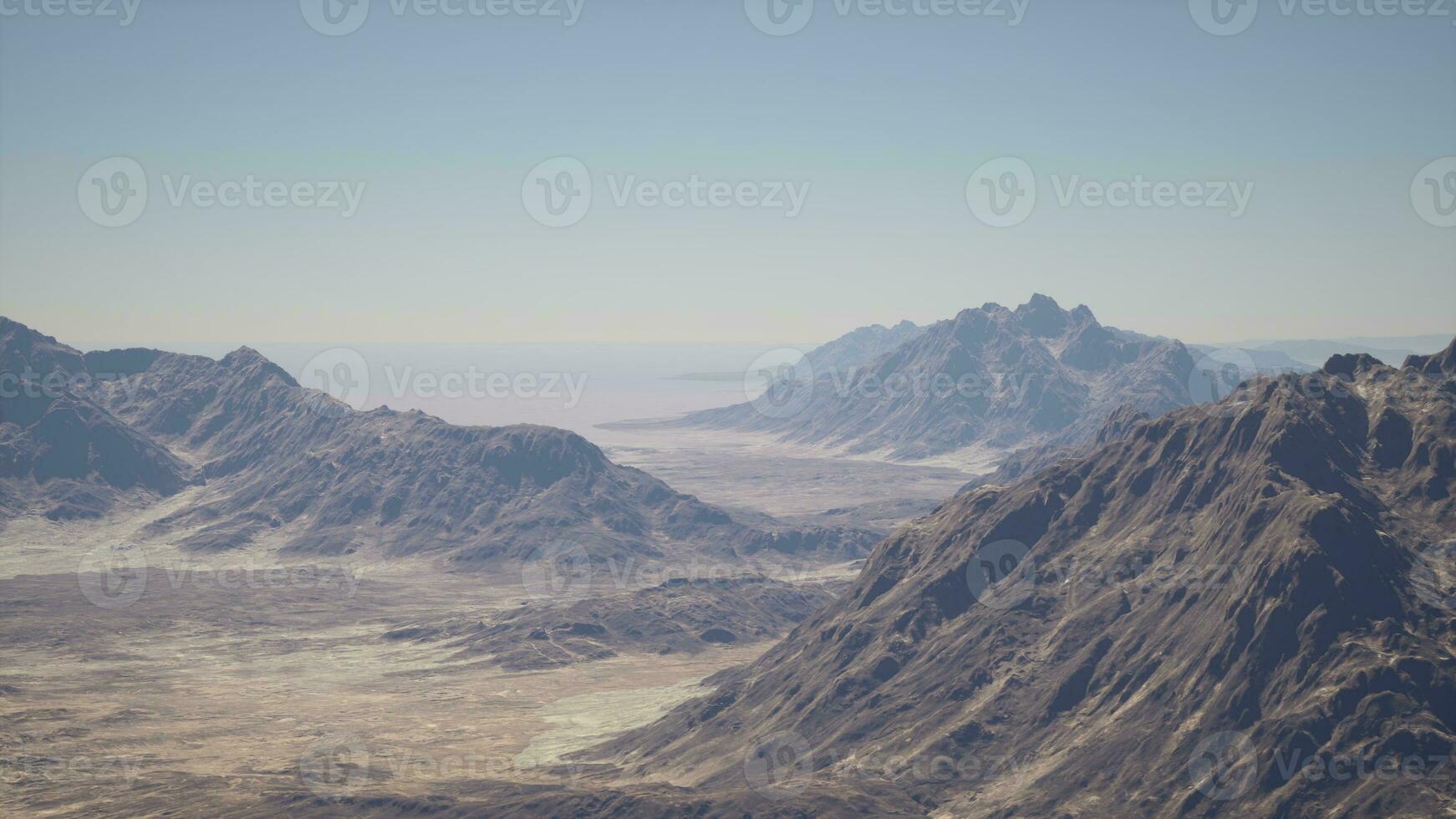 An aerial view of a mountain range in the desert photo