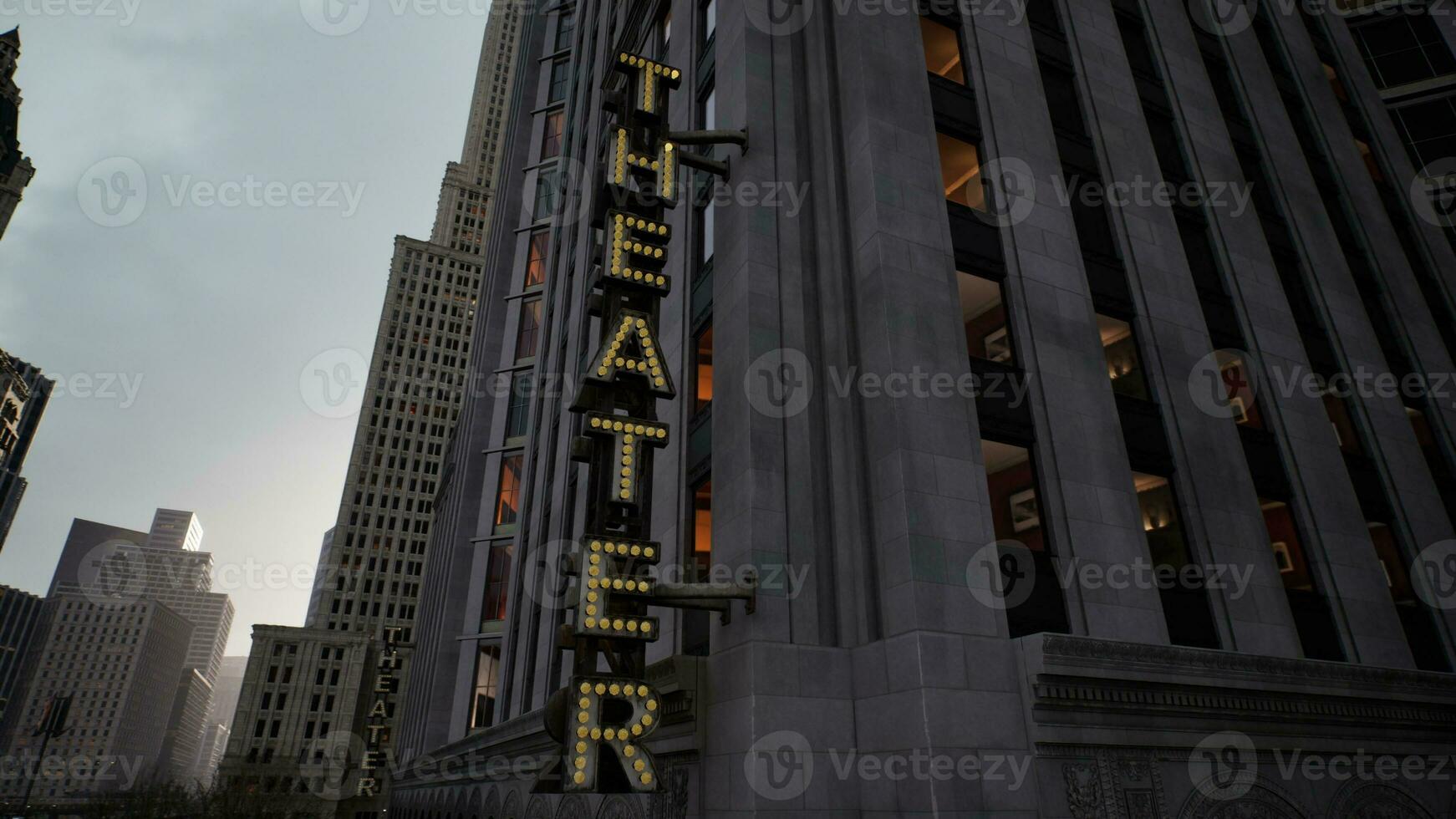 A theater sign on a tall building photo