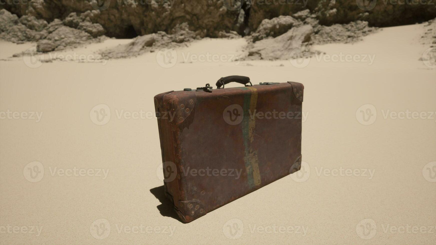 A piece of luggage sitting on top of a sandy beach photo