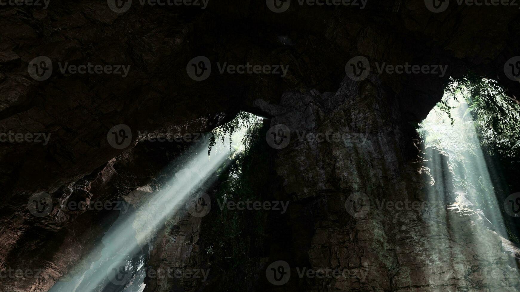 Sunlight streaming into a mysterious cave, creating a volume of light photo