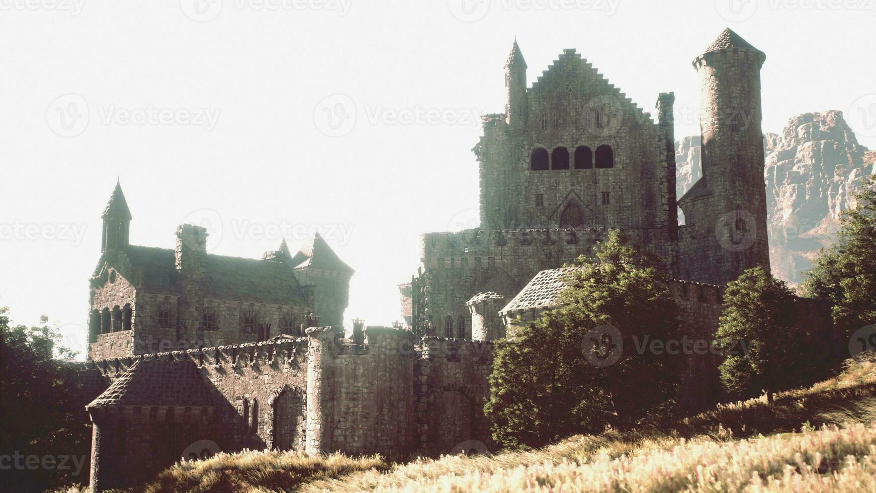 Old ruined castle in the misty mountains photo