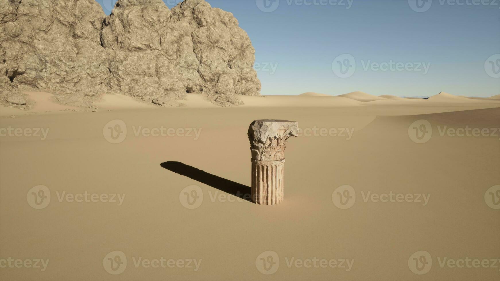 A stone pillar in the middle of a desert photo