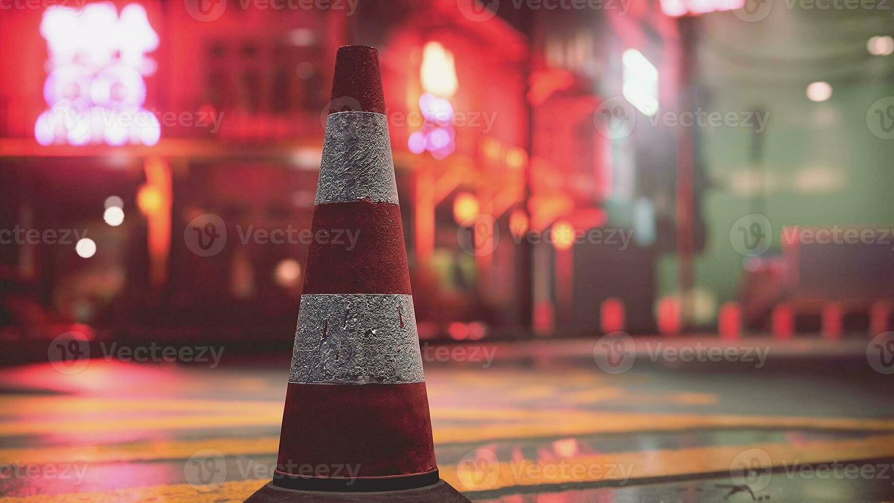 un rojo y blanco tráfico cono sentado en parte superior de un calle foto