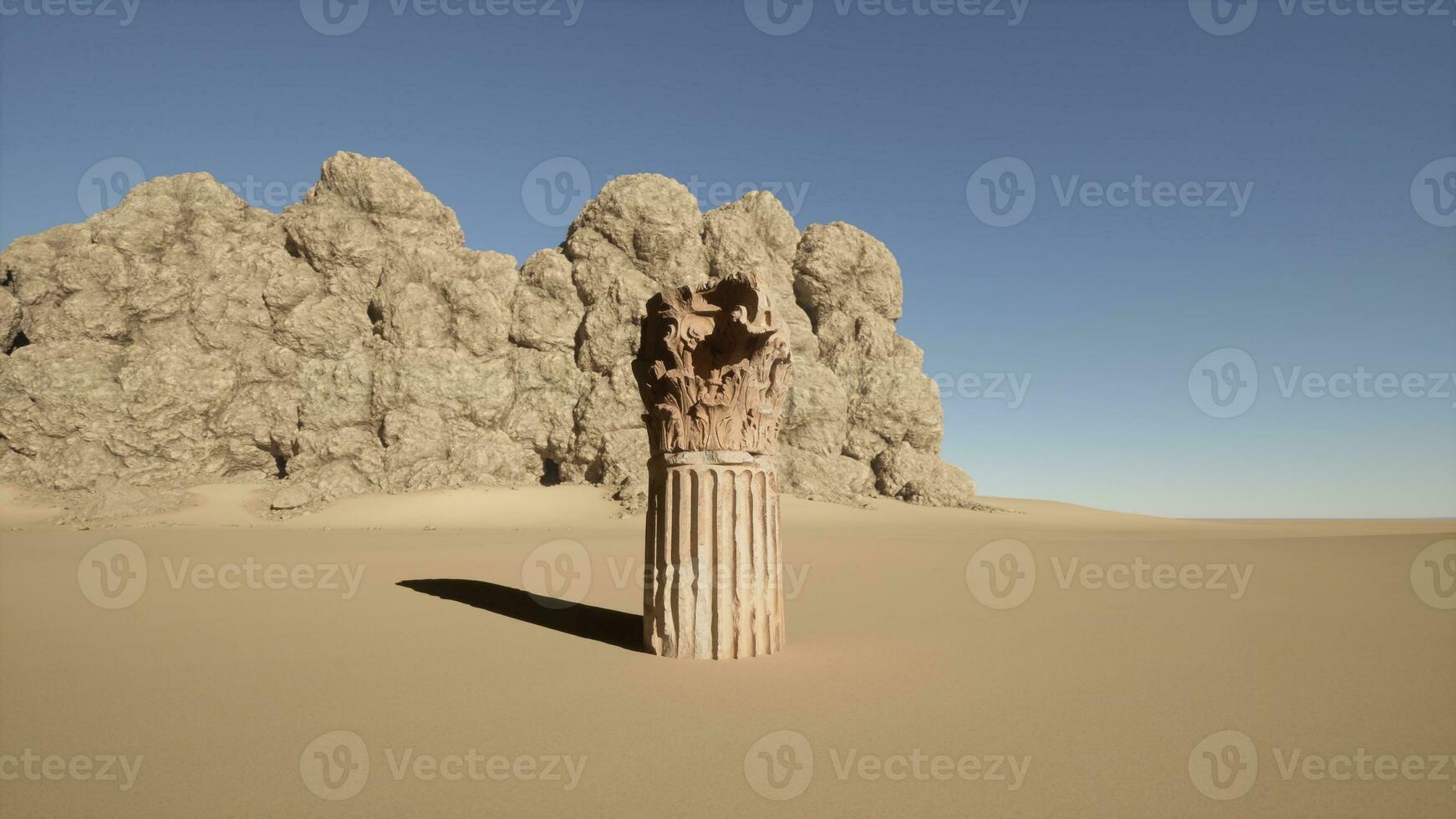 A stone pillar in the middle of a desert photo