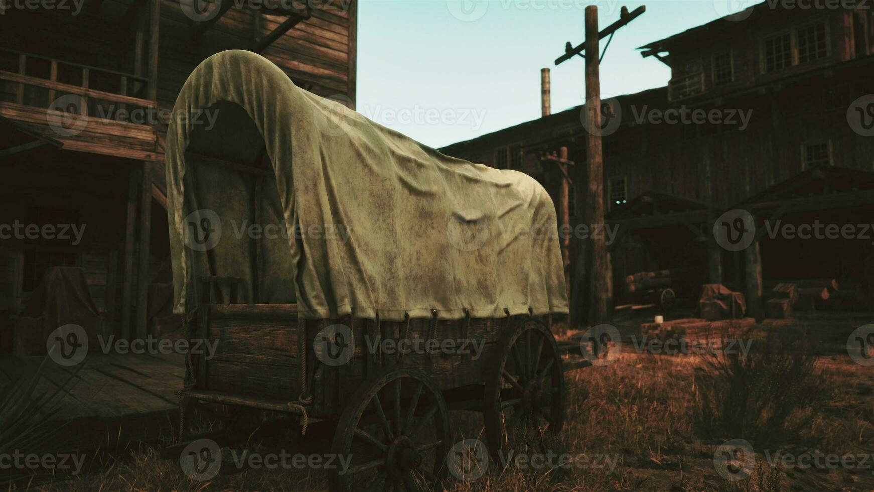 un antiguo cubierto vagón en frente de un histórico edificio foto