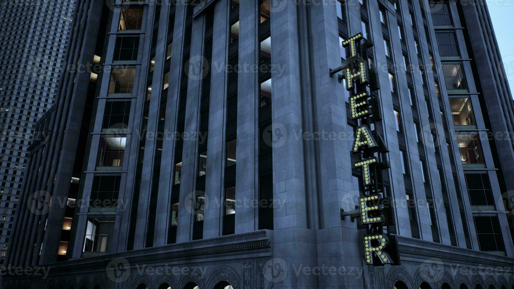 A towering building with a vibrant neon sign illuminating the night sky photo