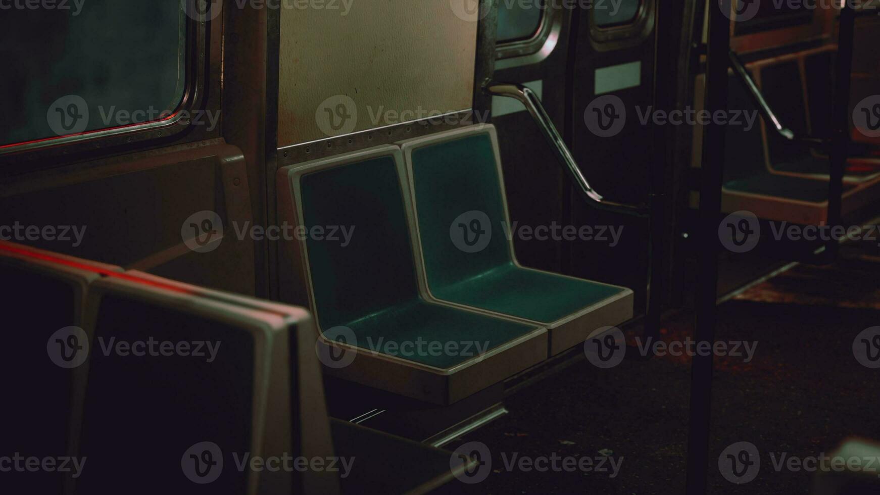 A green seat on a metro train next to a window photo