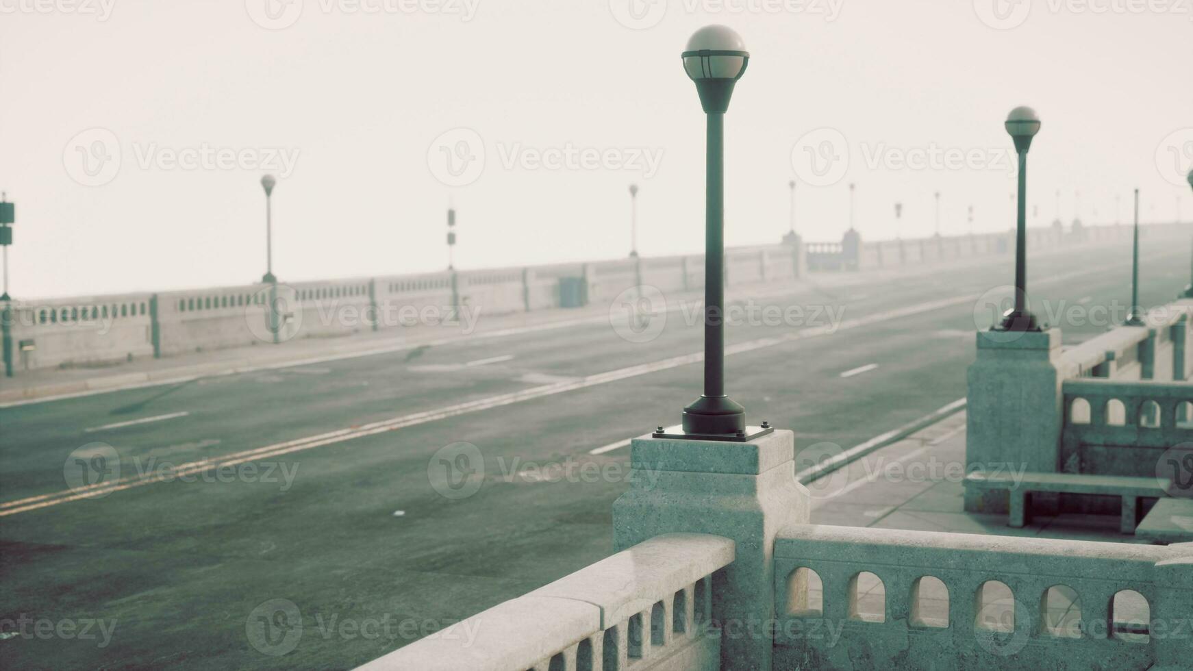 Old empty bridge on a foggy day photo