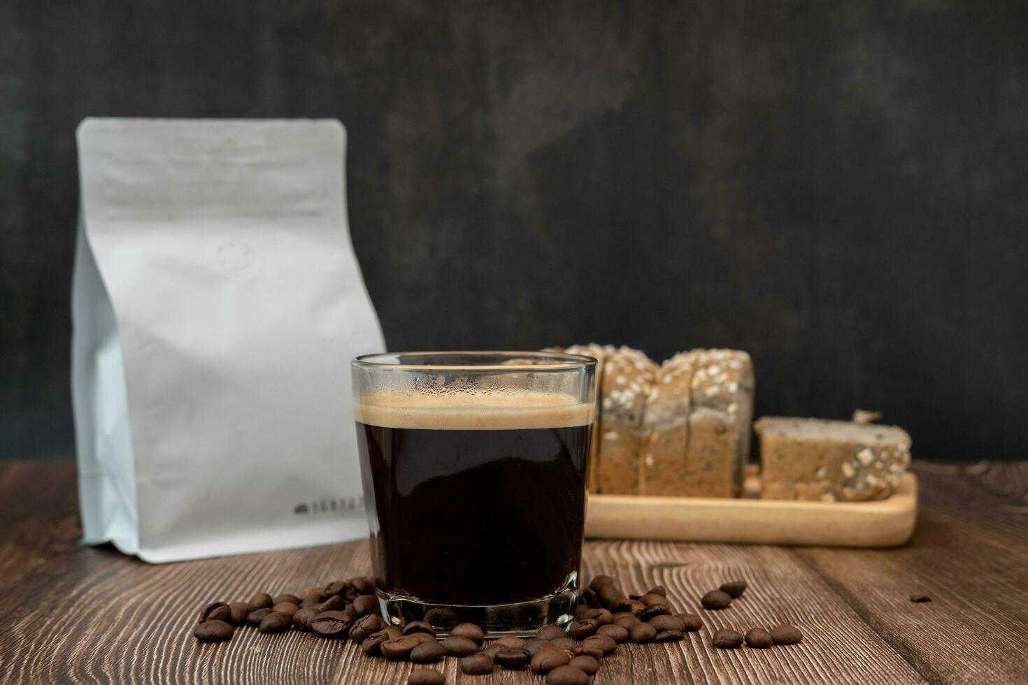 Coffee cup, coffee flavored bread slices with coffee beans around photo