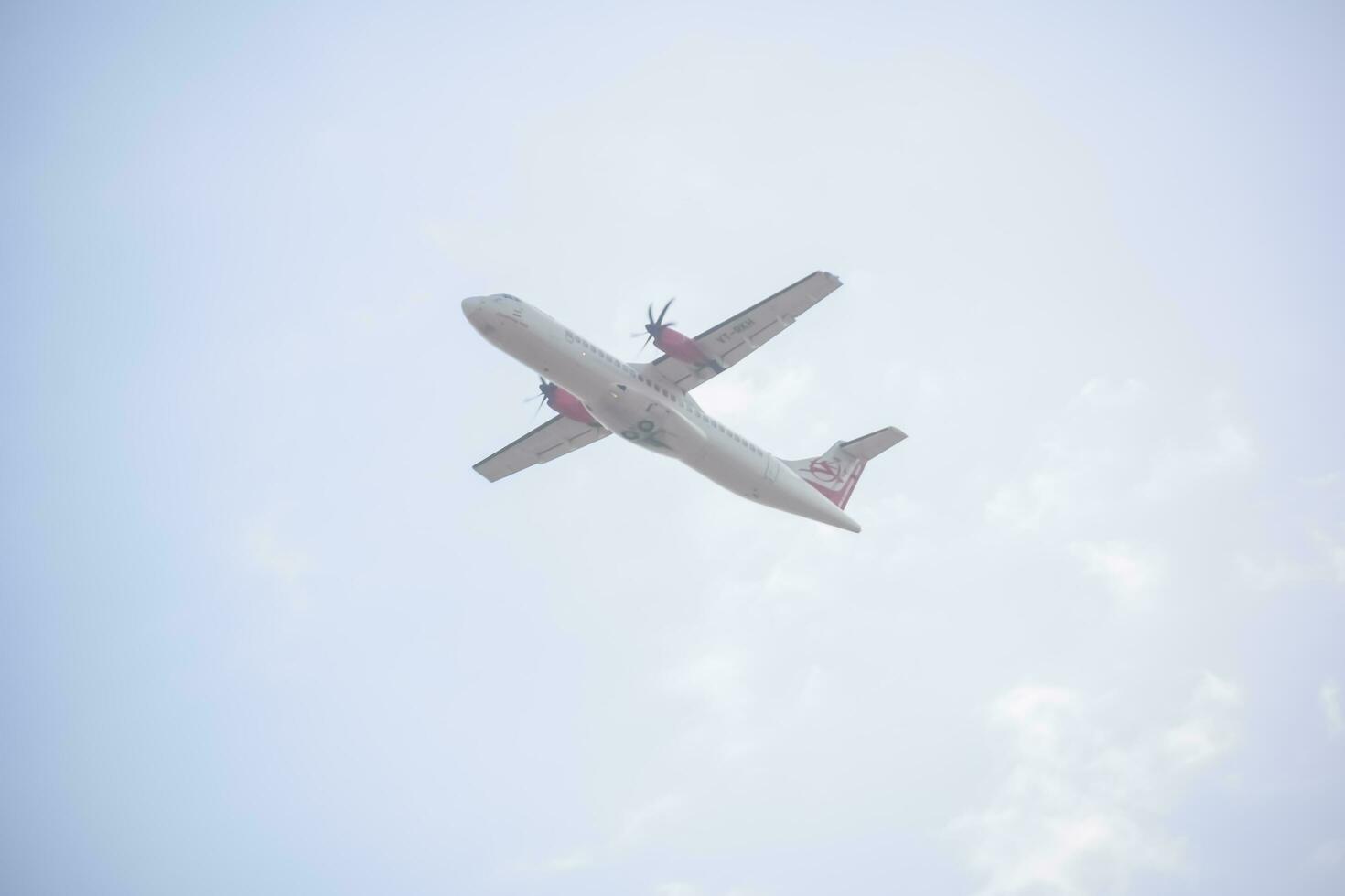 New Delhi, India, April 16 2023 - Private Jet take off from Indra Gandhi International Airport Delhi, Compact plane domestic aeroplane flying in the blue sky during day time photo