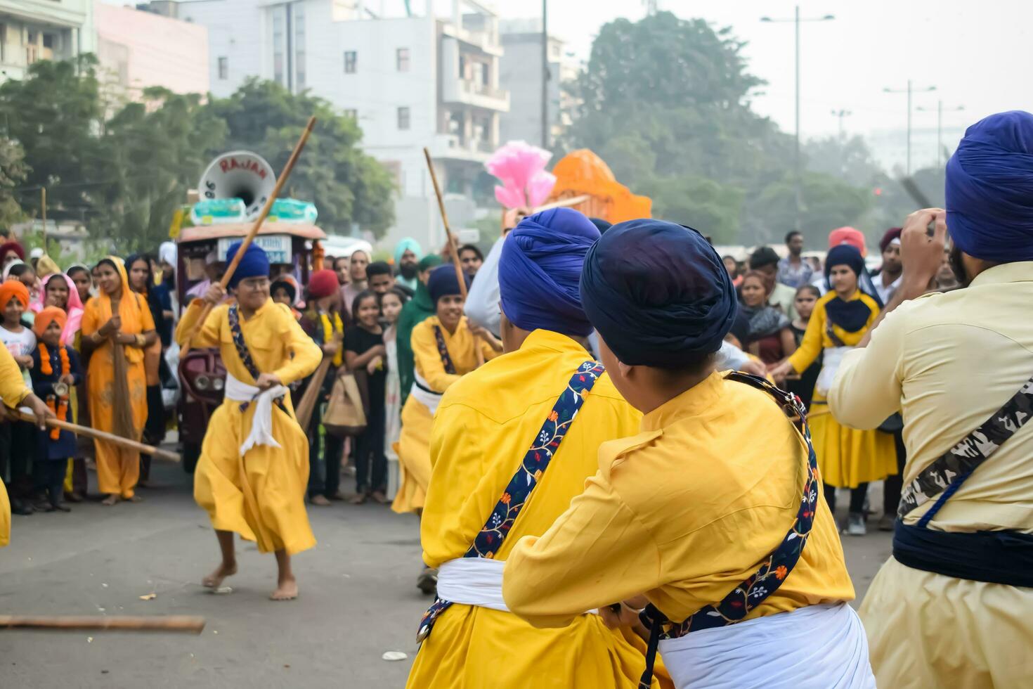 Delhi, India, October 2, 2023 - Sikhs display gatka and martial arts during annual Nagar Kirtan, Traditional, procession on account of birthday of Guru Nanak Dev ji, Nagar Kirtan in East Delhi area photo