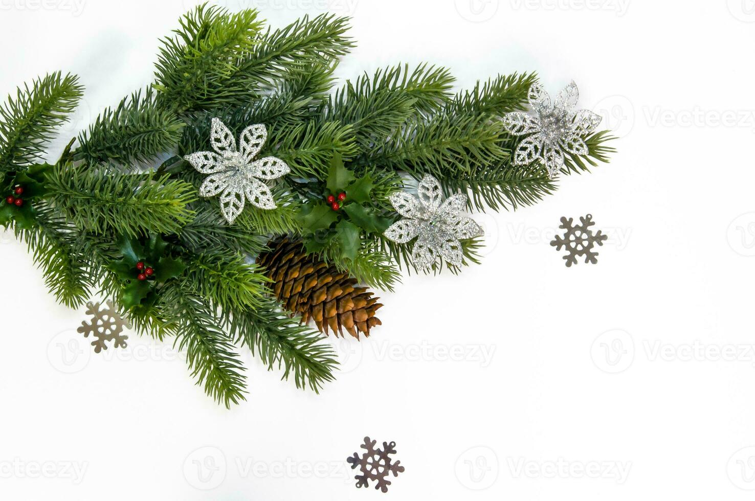 Christmas background. Fir branches with decorations on a white background photo