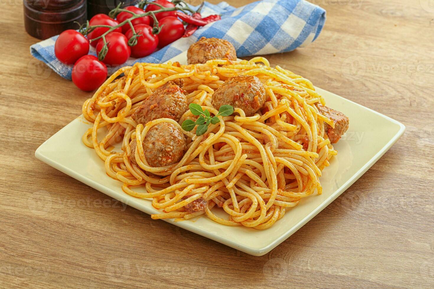 Spaghetti with meatball in tomato sause photo