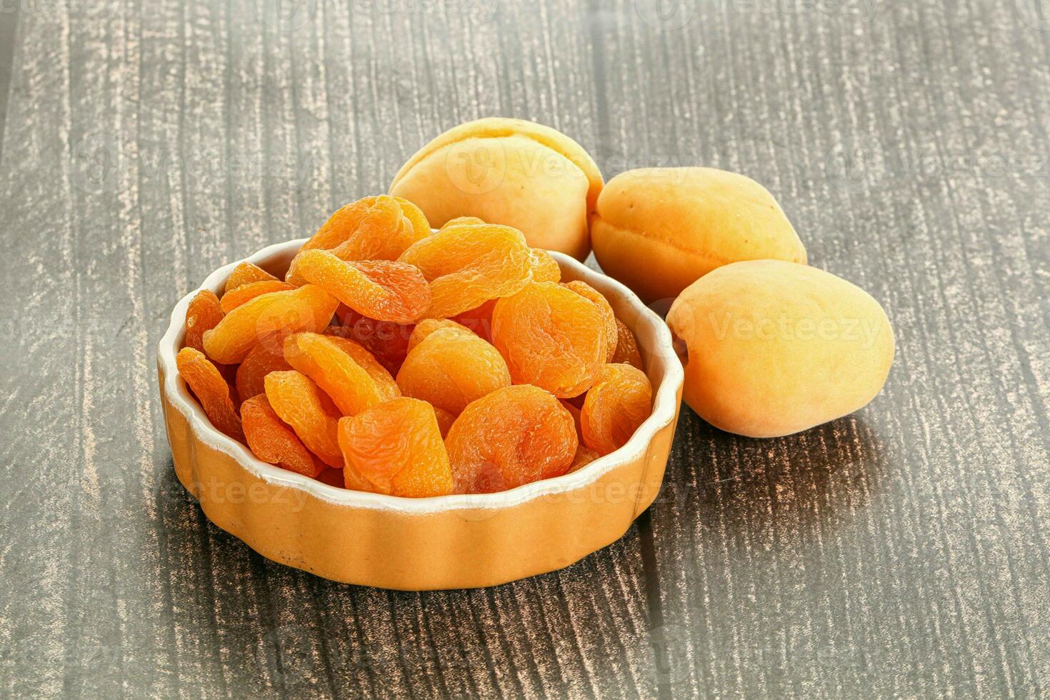 Dried apricot heap in the bowl photo