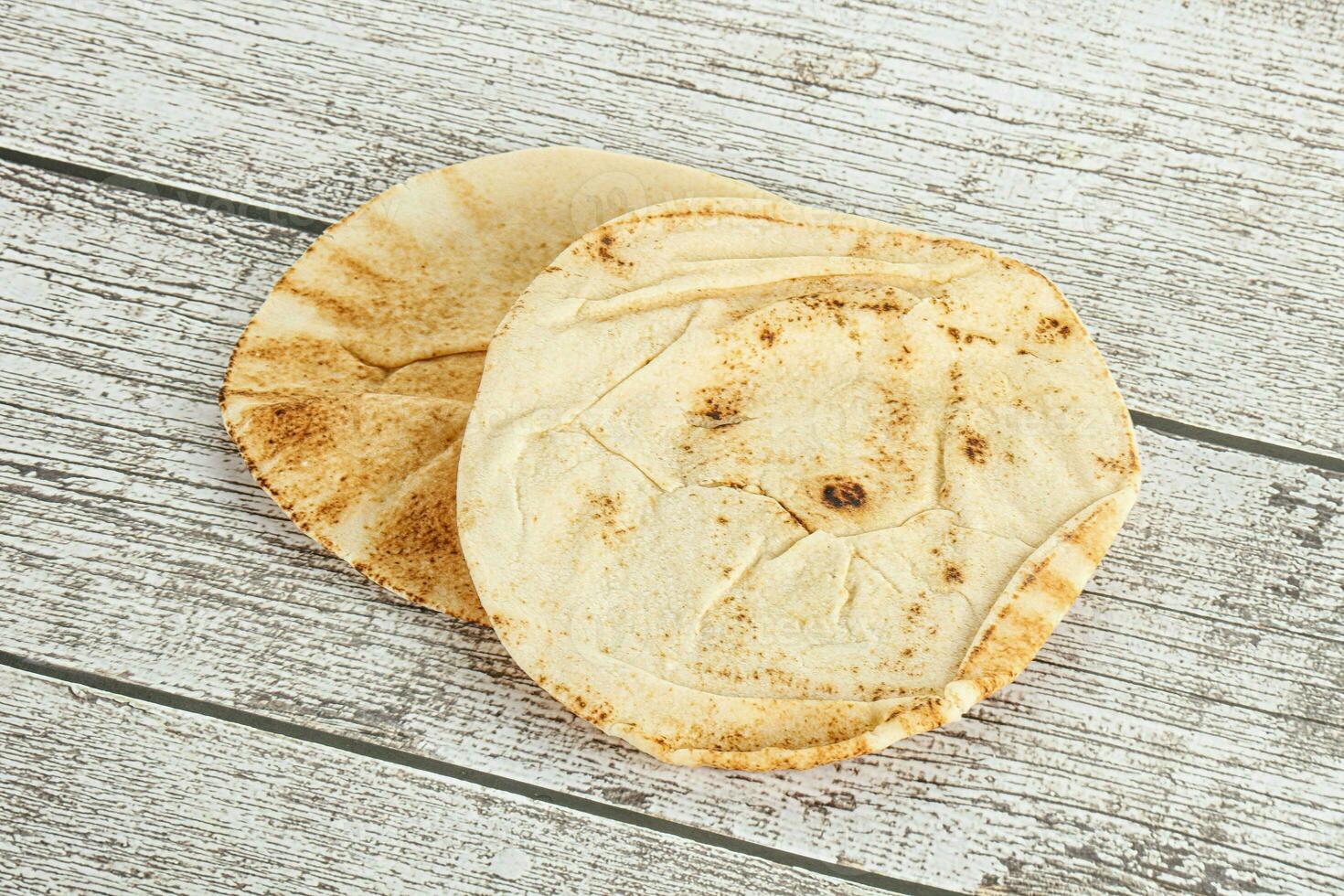 Traditional eastern round pita bread photo