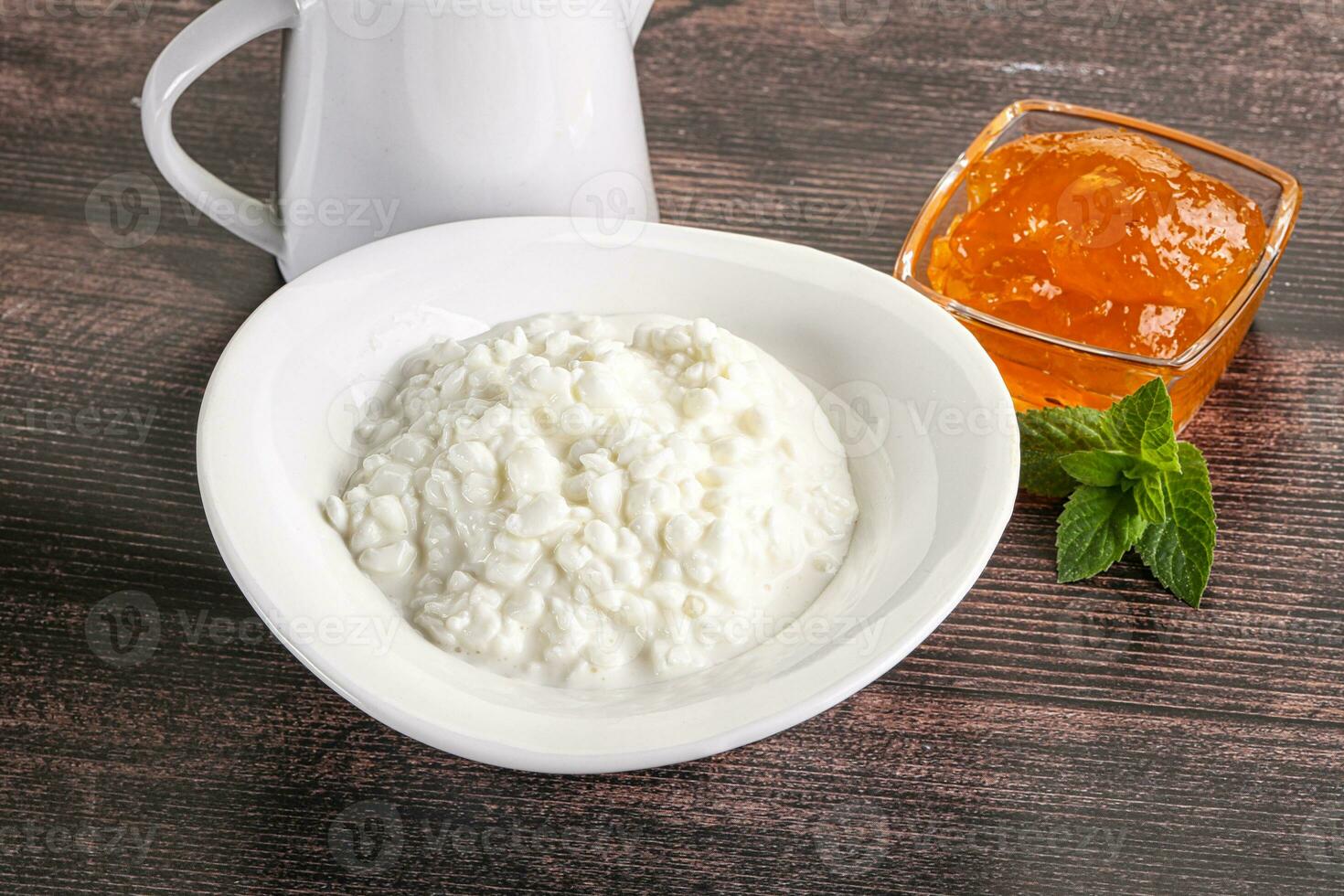 Grain curd with cream and jam photo