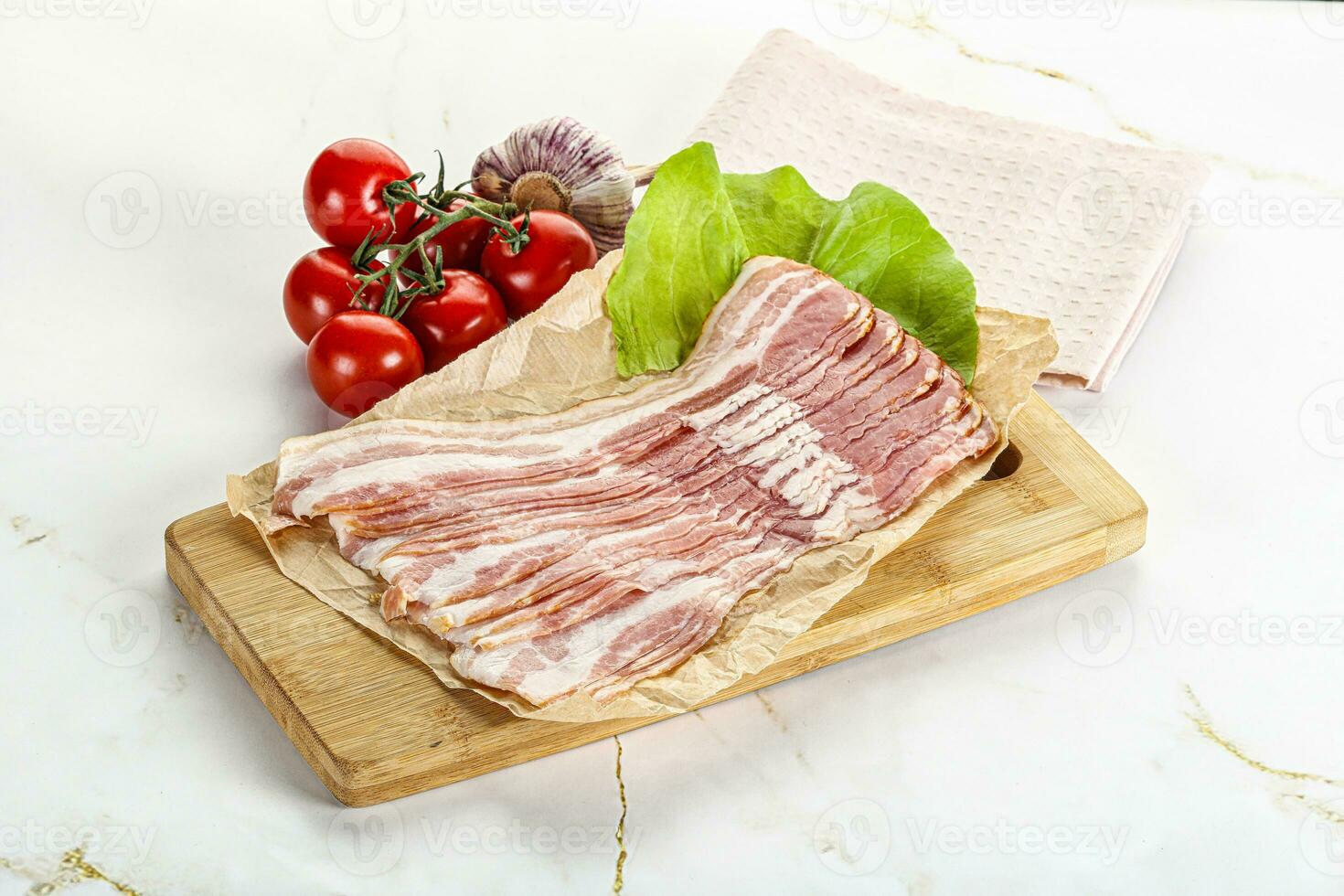 Sliced pork bacon oved board photo