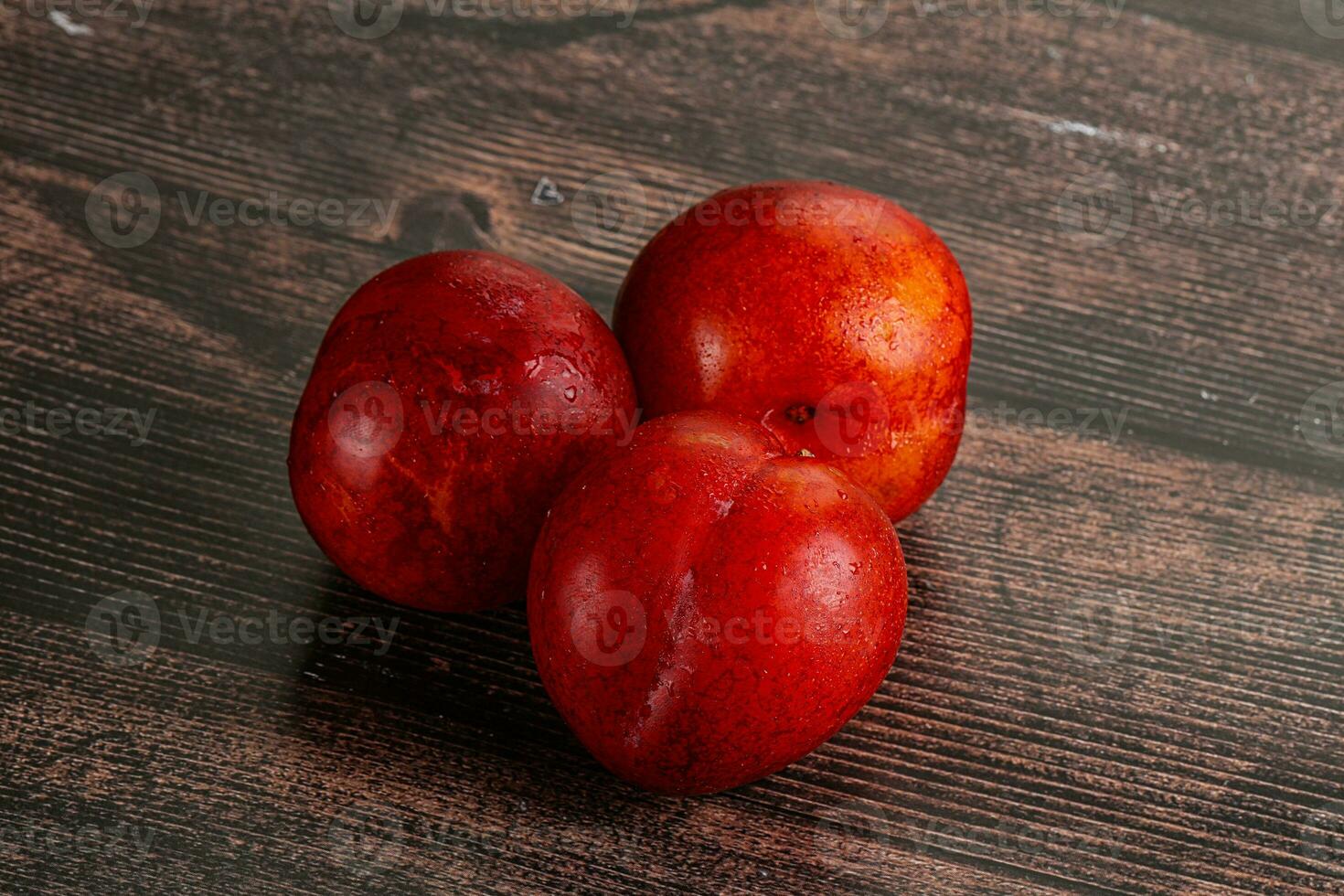 Ripe sweet juicy red plum photo