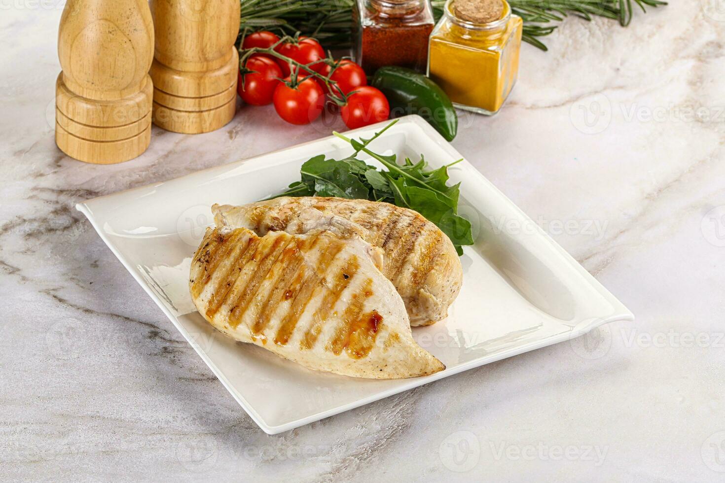 Grilled chicken breast served arugula photo