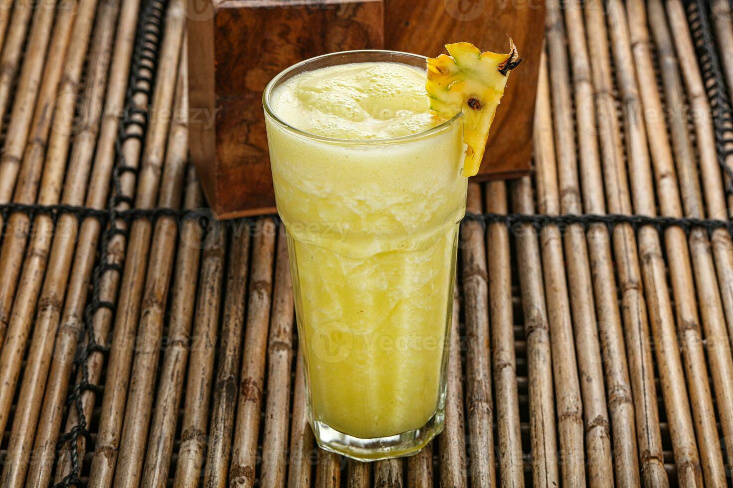 Sweet cold pineapple juice refreshment photo