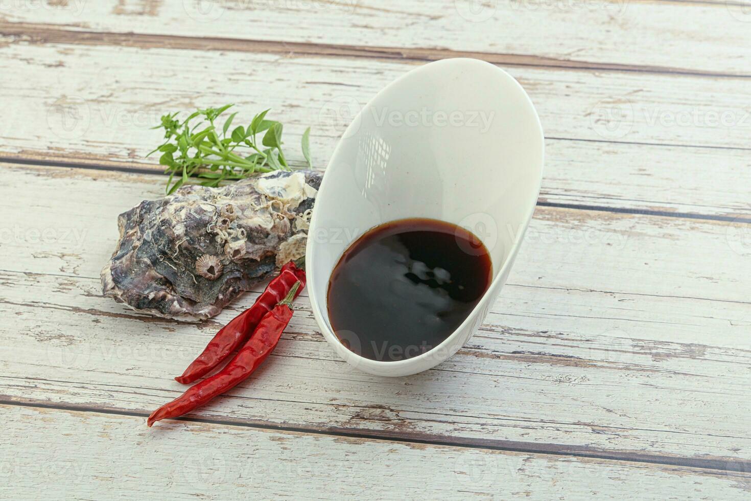 Chinese cuisine - oyster sauce served shell photo
