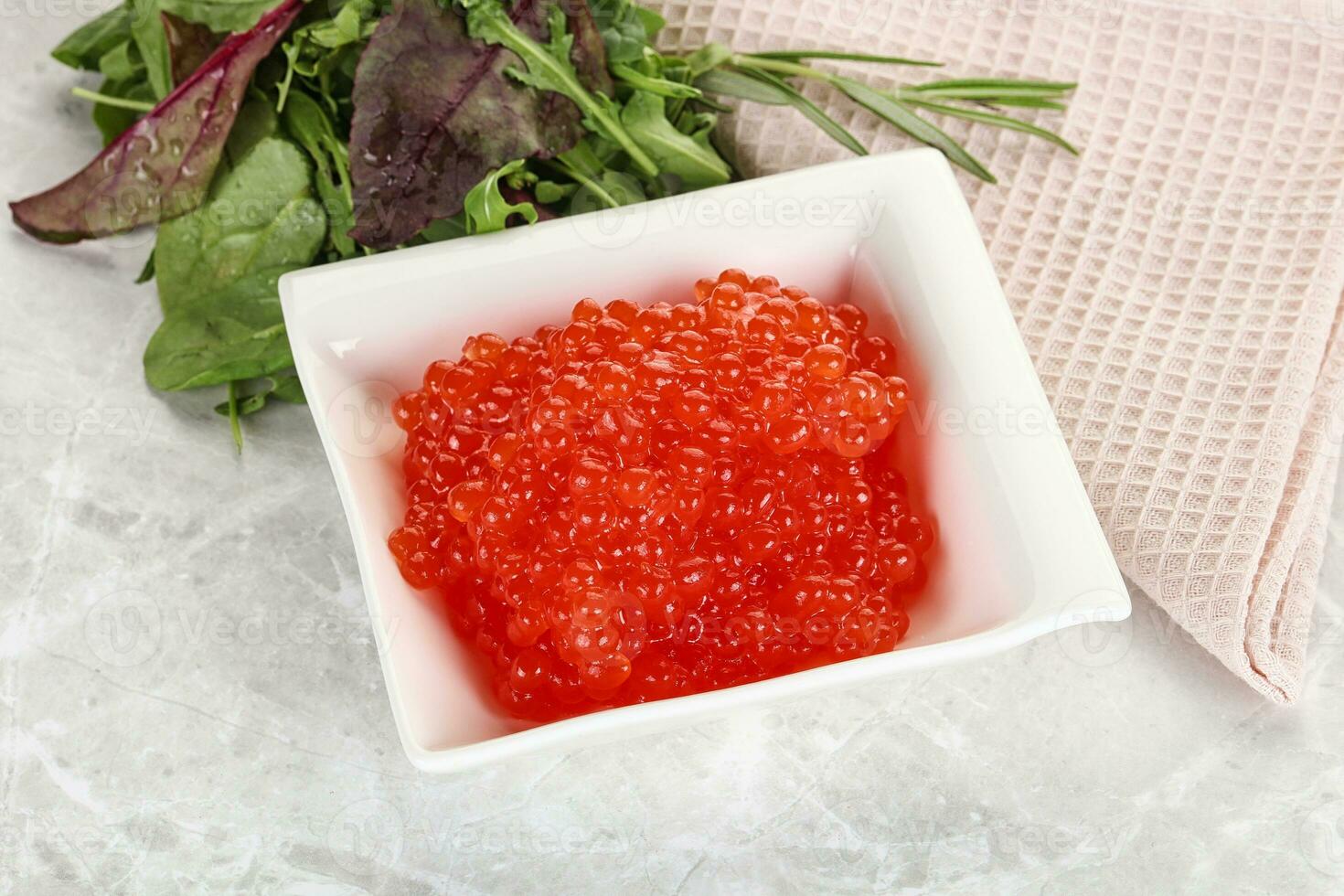 Red caviar in the bowl photo