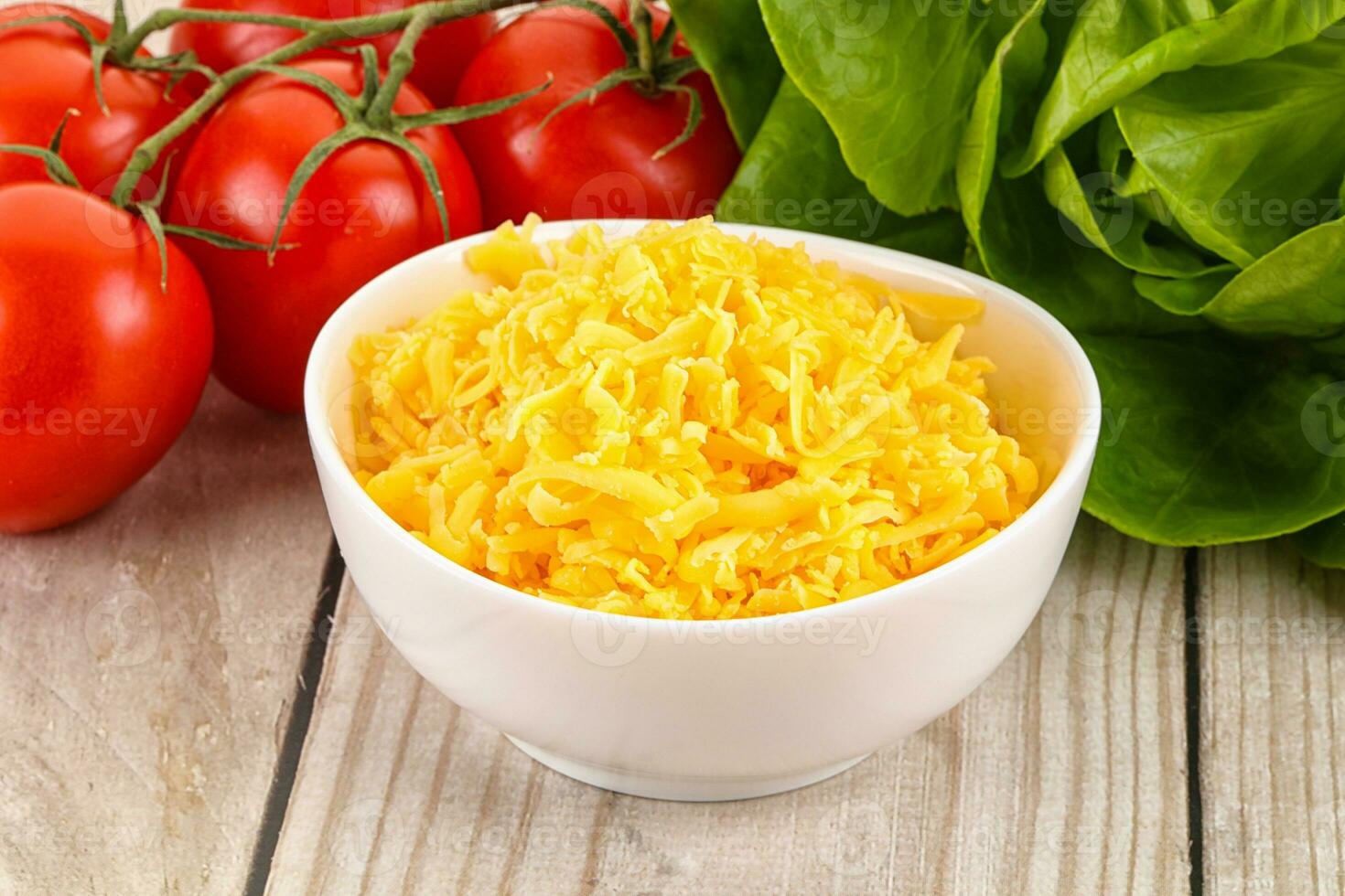 Shredded cheese in the bowl photo