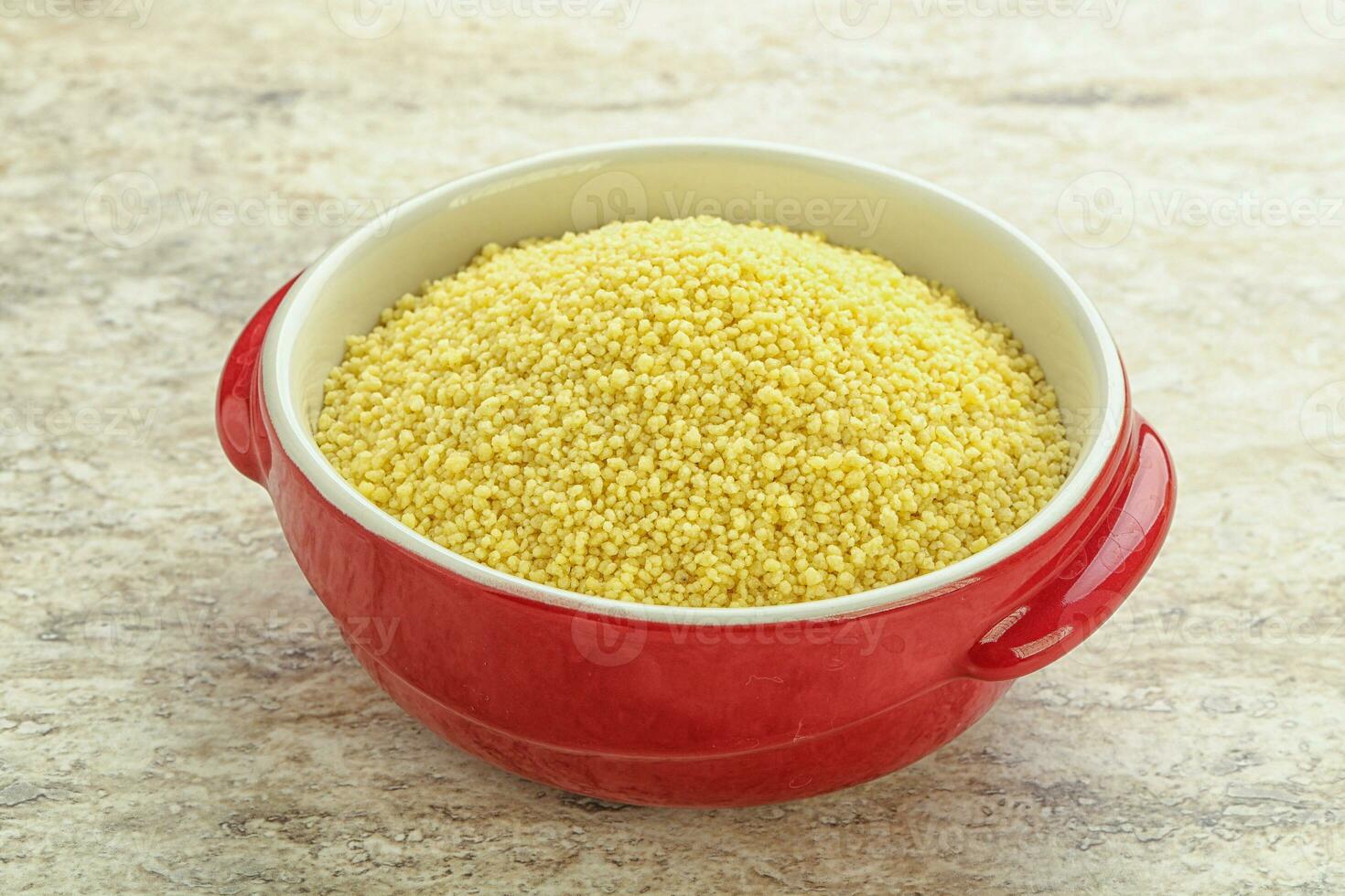 Raw couscous in the bowl photo