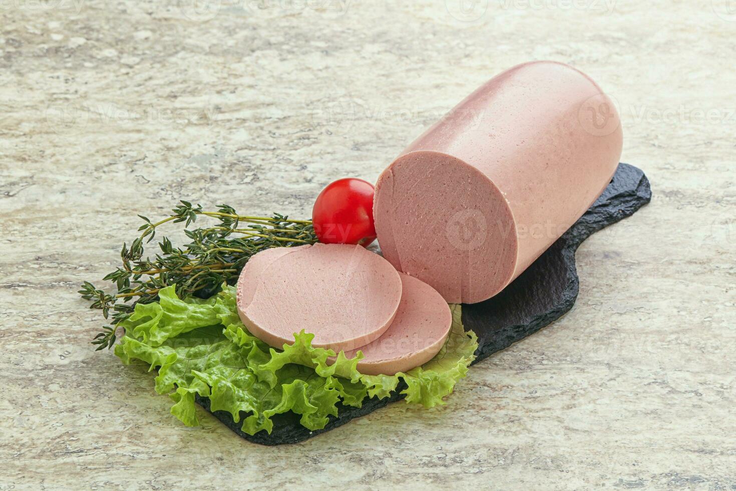 Boiled sausage with two slices photo