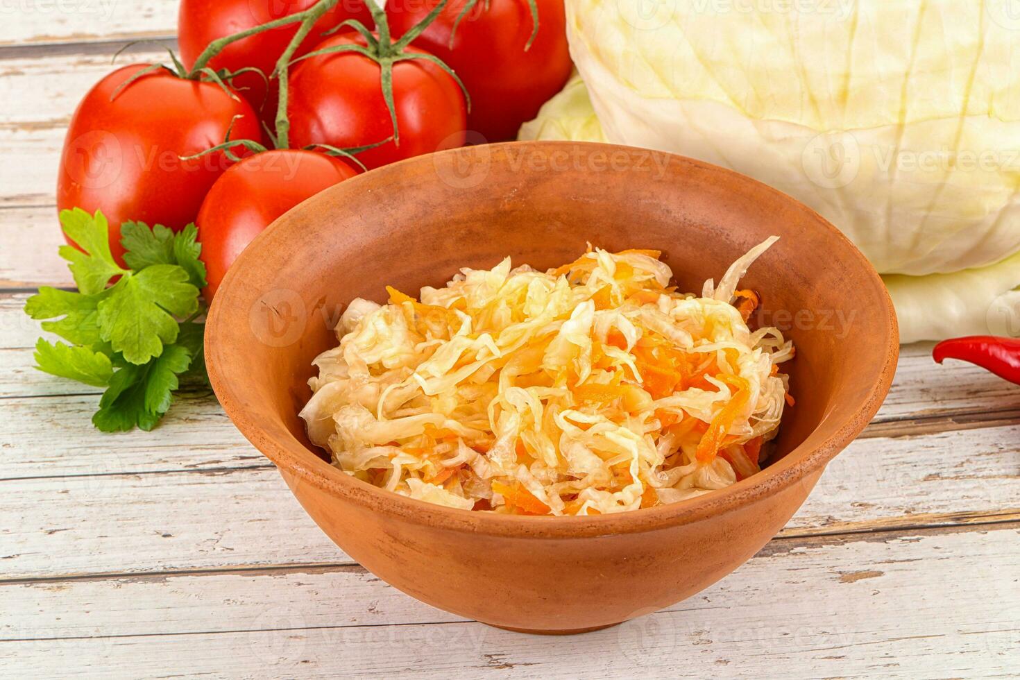 Fermented cabbage sauerkraut in the bowl photo