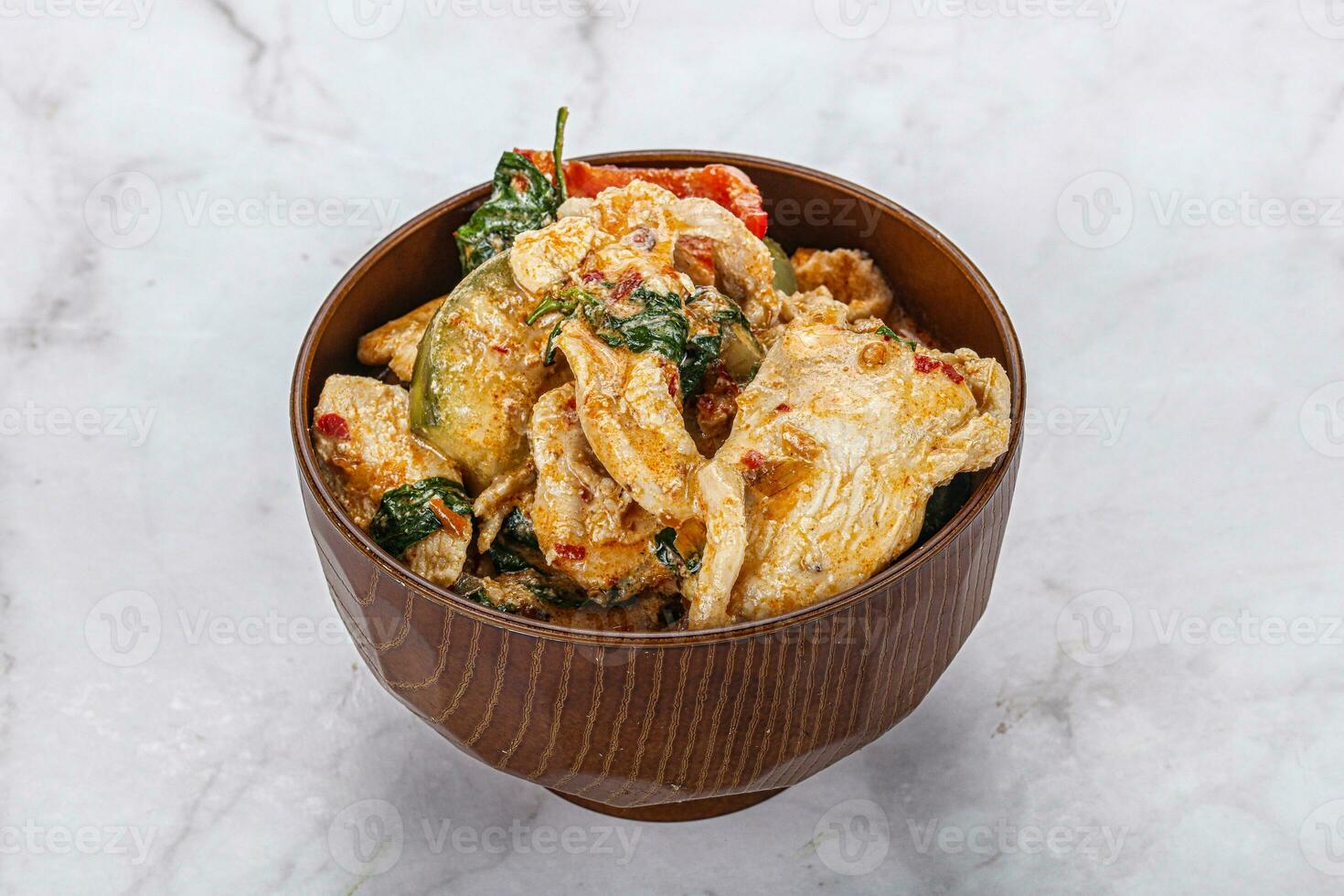 Thai red spicy curry with chicken photo