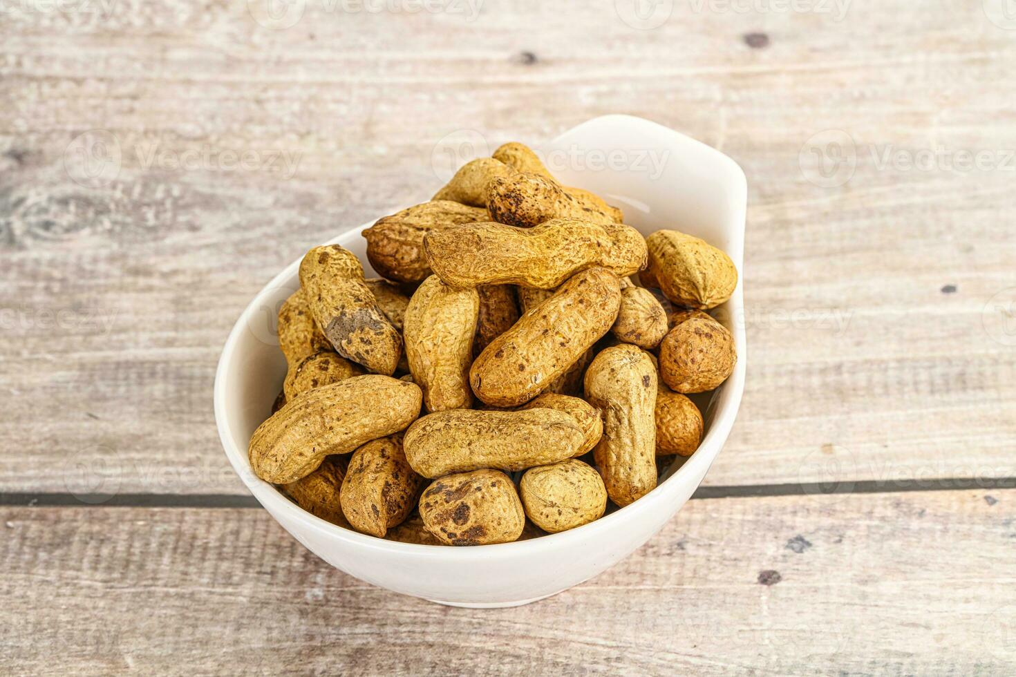 Raw ripe unpeeled peanut heap photo