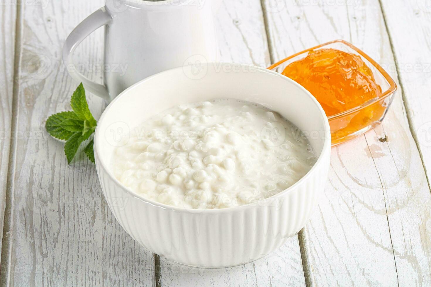 Grain curd with cream and jam photo