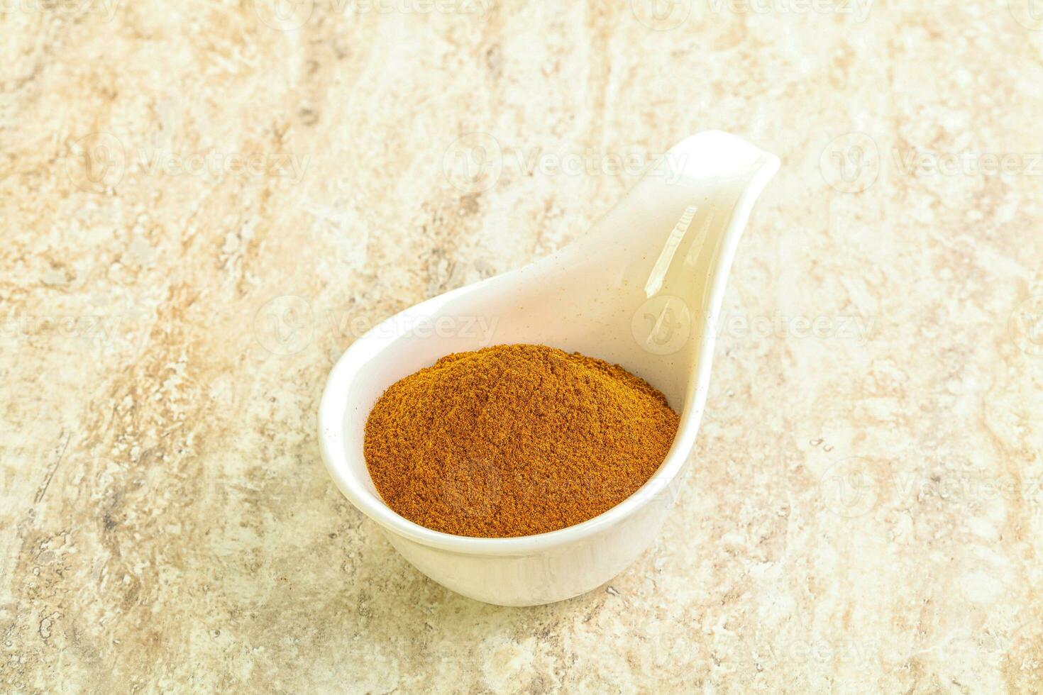 Dry Paprika powder in the bowl photo