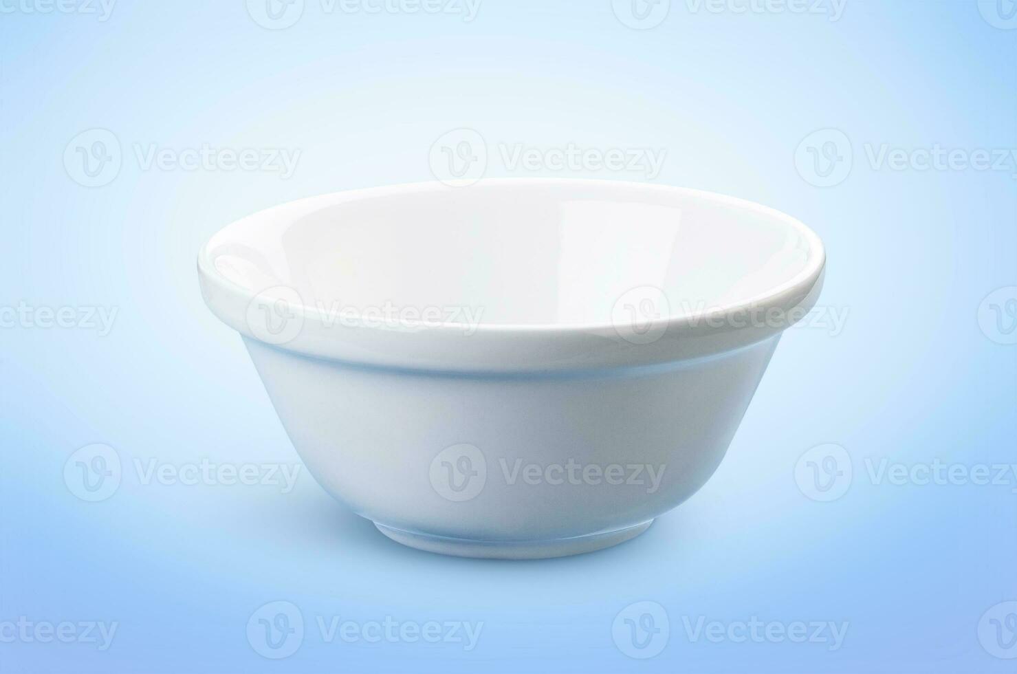 Empty white bowl isolated on blue background, ideal for the presentation of dairy products photo