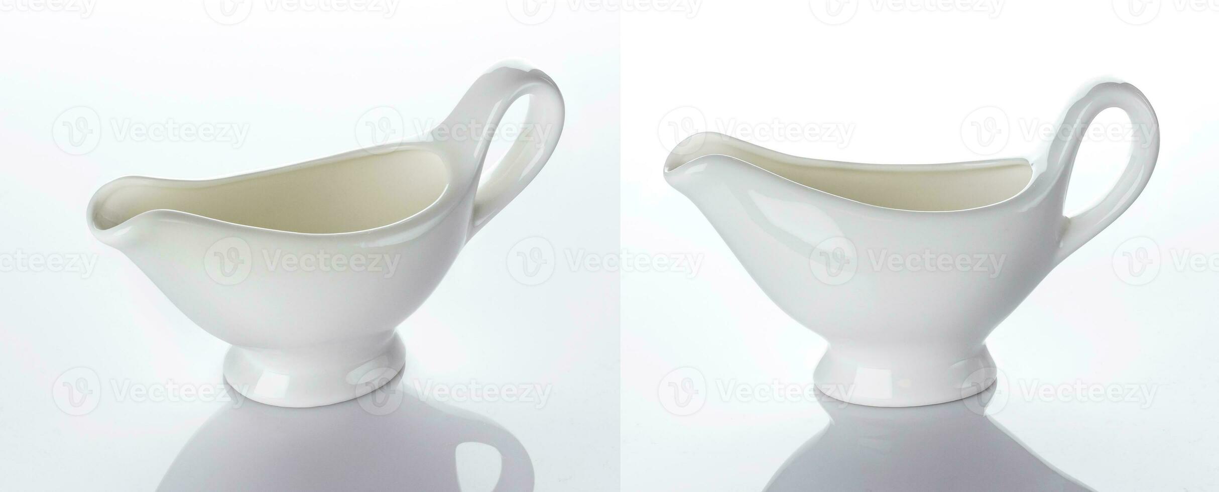 Empty ceramic creamer isolated on white background photo