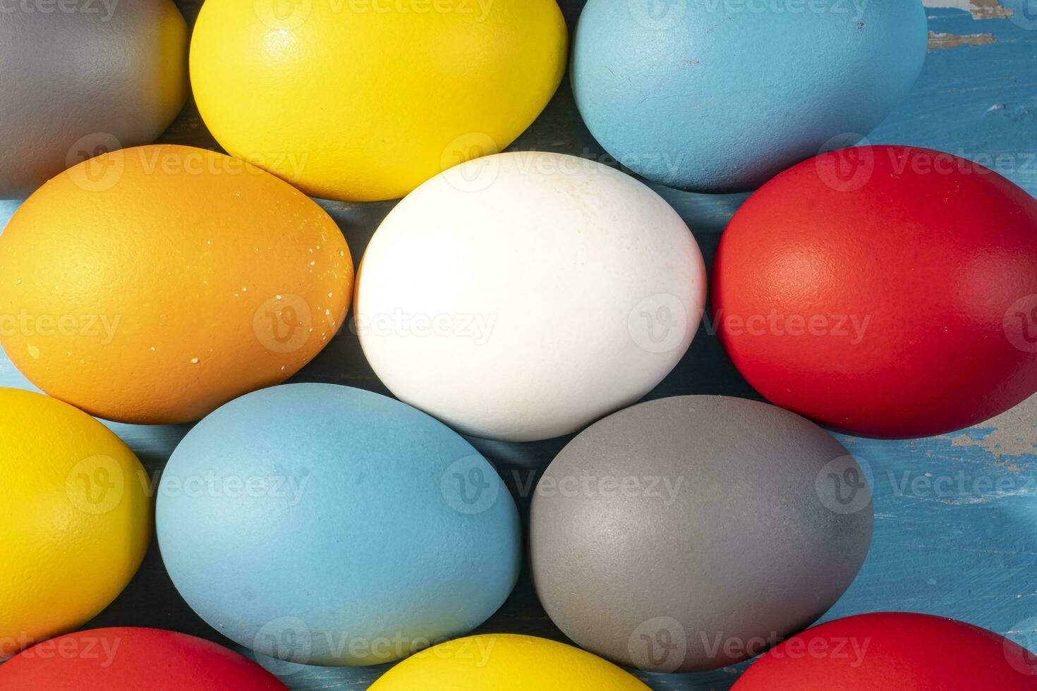 eggs painted in different colors to symbolize the passage of Christian Easter photo
