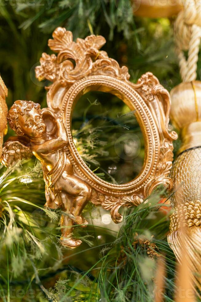 Close-up view of the Christmas ornaments hanging on the Christmas tree. photo