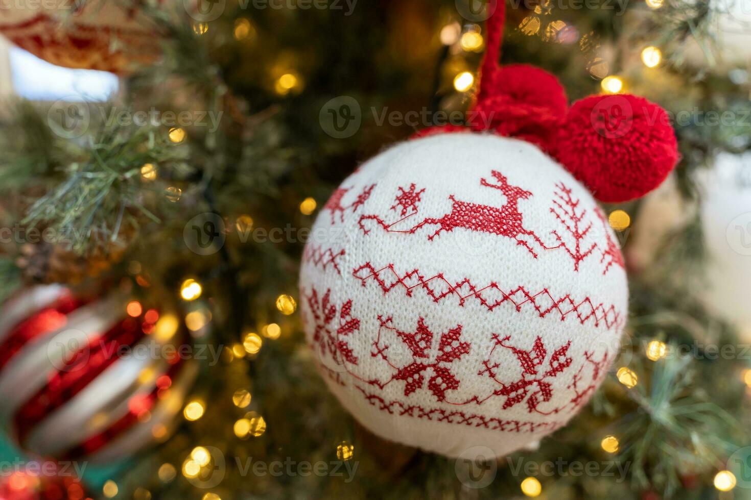 Close-up view of the Christmas ornaments hanging on the Christmas tree. photo