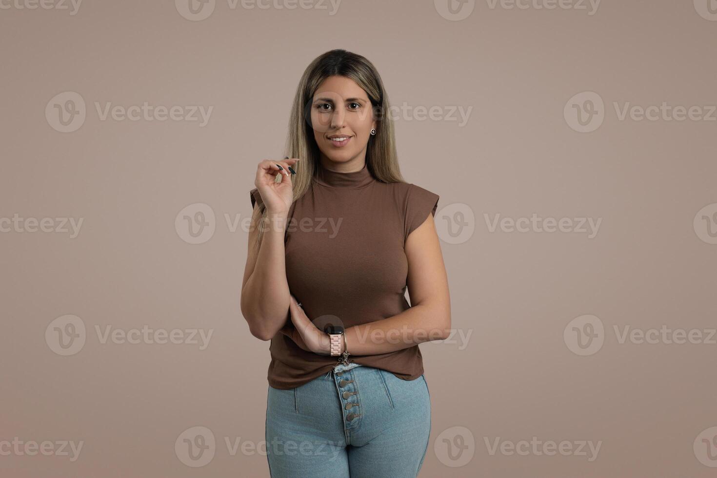 Smiling Woman with Brown Hair in Spring Fashion Standing Indoors photo