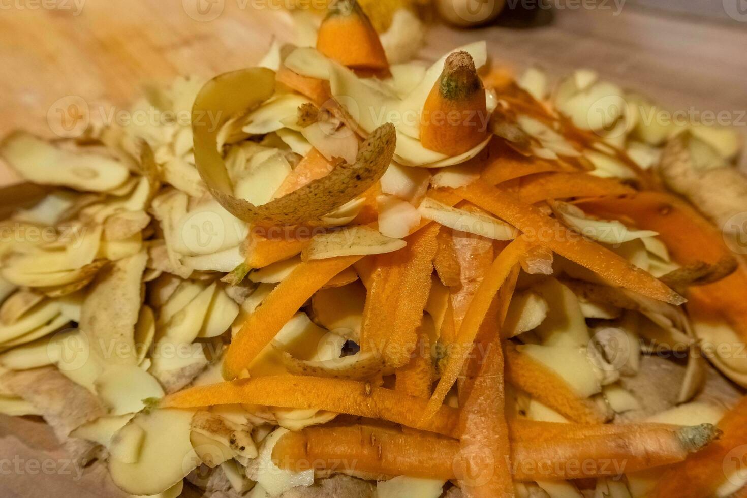 kitchen waste with potato and carrot peelings photo