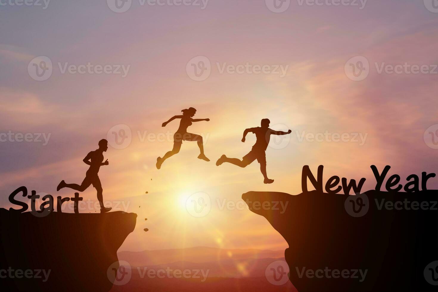 Ideas for starting a business and competing with challenges or a new career. Silhouettes of people jumping over cliffs in evening sunlight. It represents the beginning of opportunity and change photo
