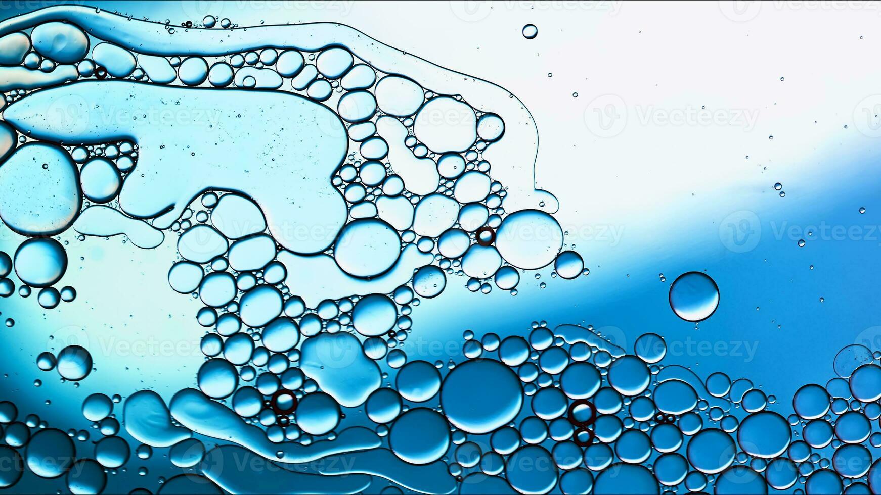 Abstract Colorful Food Oil Drops Bubbles and spheres Flowing on Water Surface photo