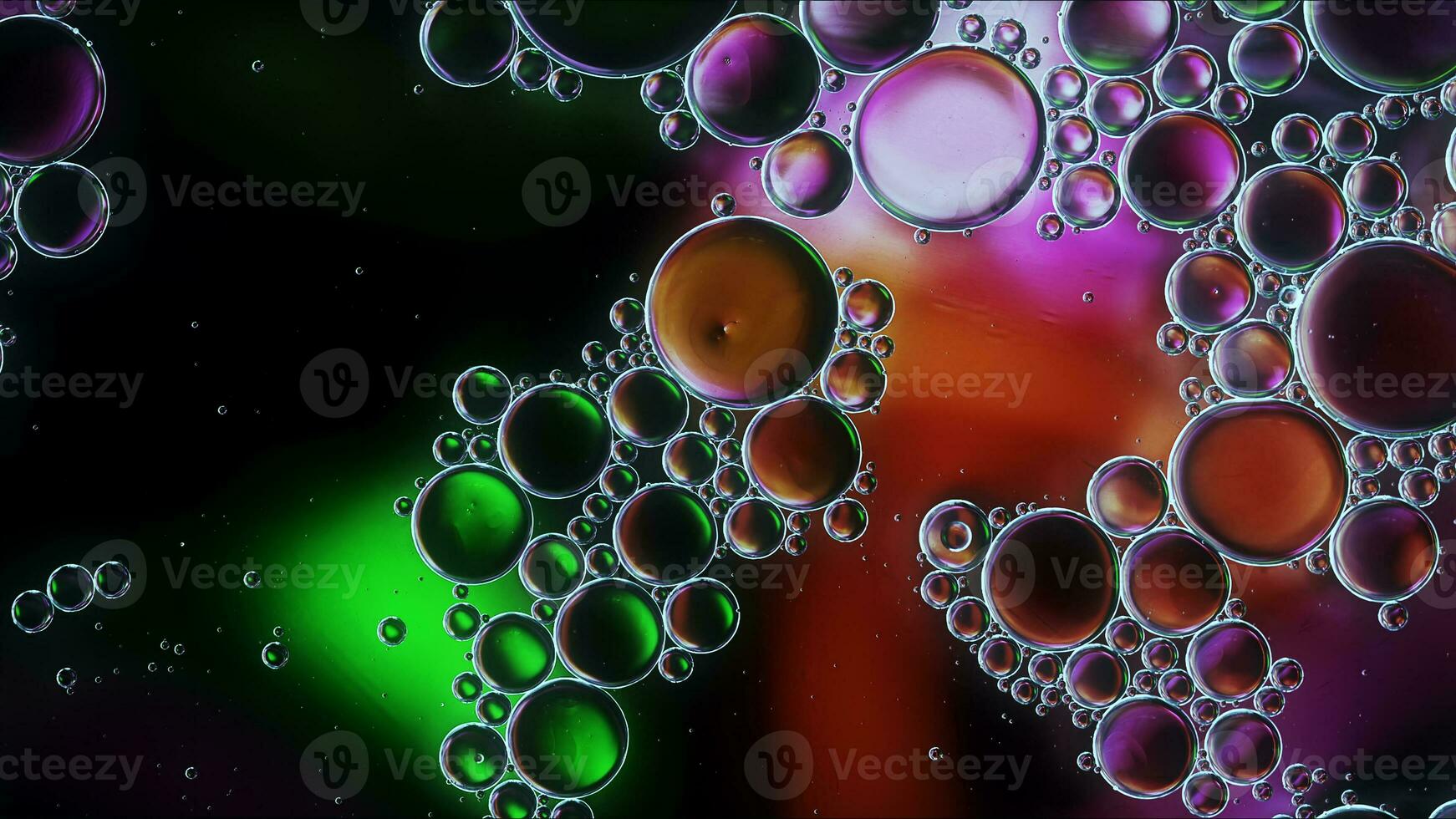 Abstract Colorful Food Oil Drops Bubbles and spheres Flowing on Water Surface photo