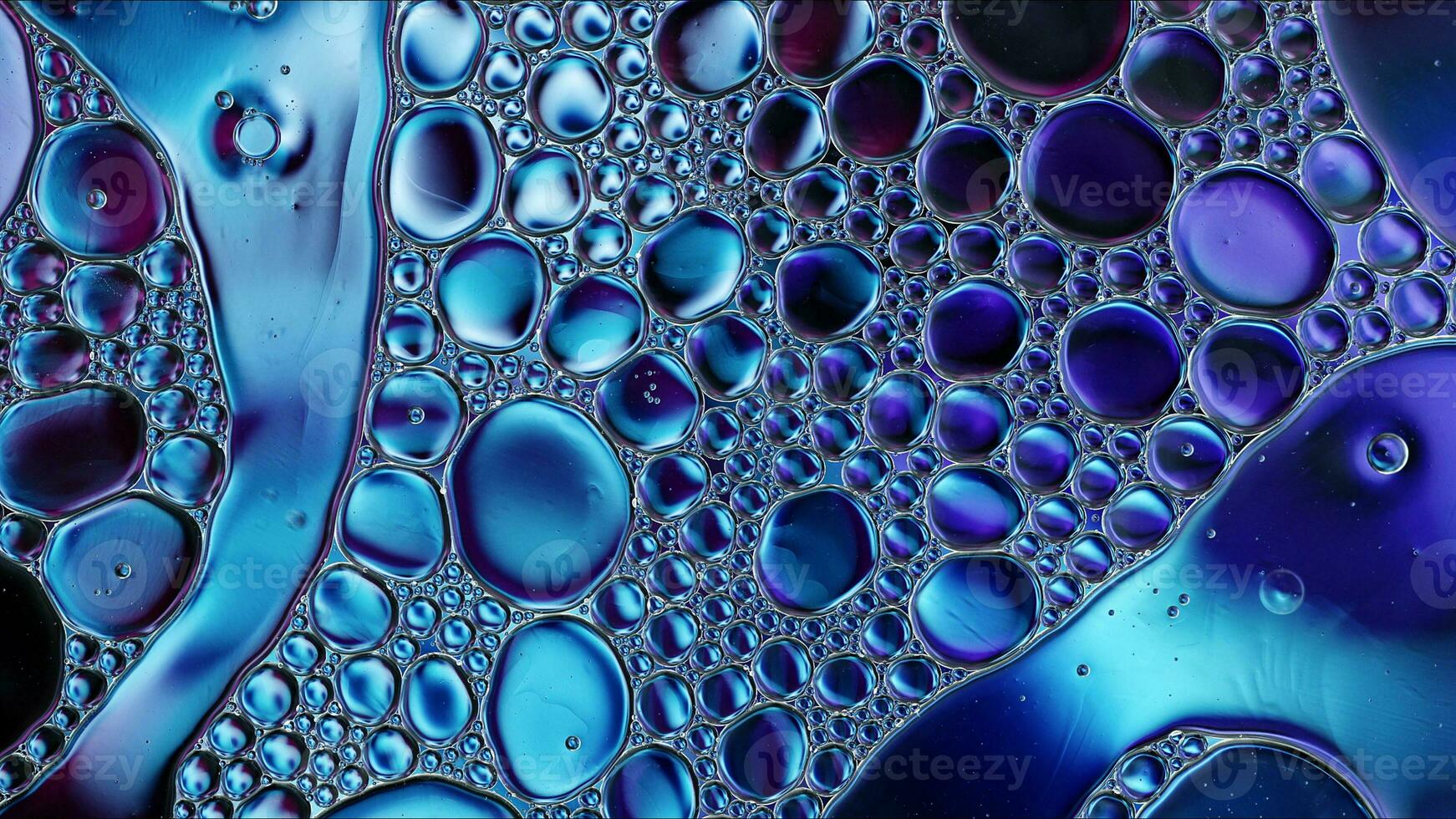 Abstract Colorful Food Oil Drops Bubbles and spheres Flowing on Water Surface photo