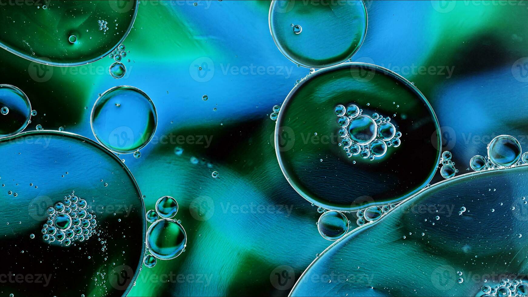 Abstract Colorful Food Oil Drops Bubbles and spheres Flowing on Water Surface photo